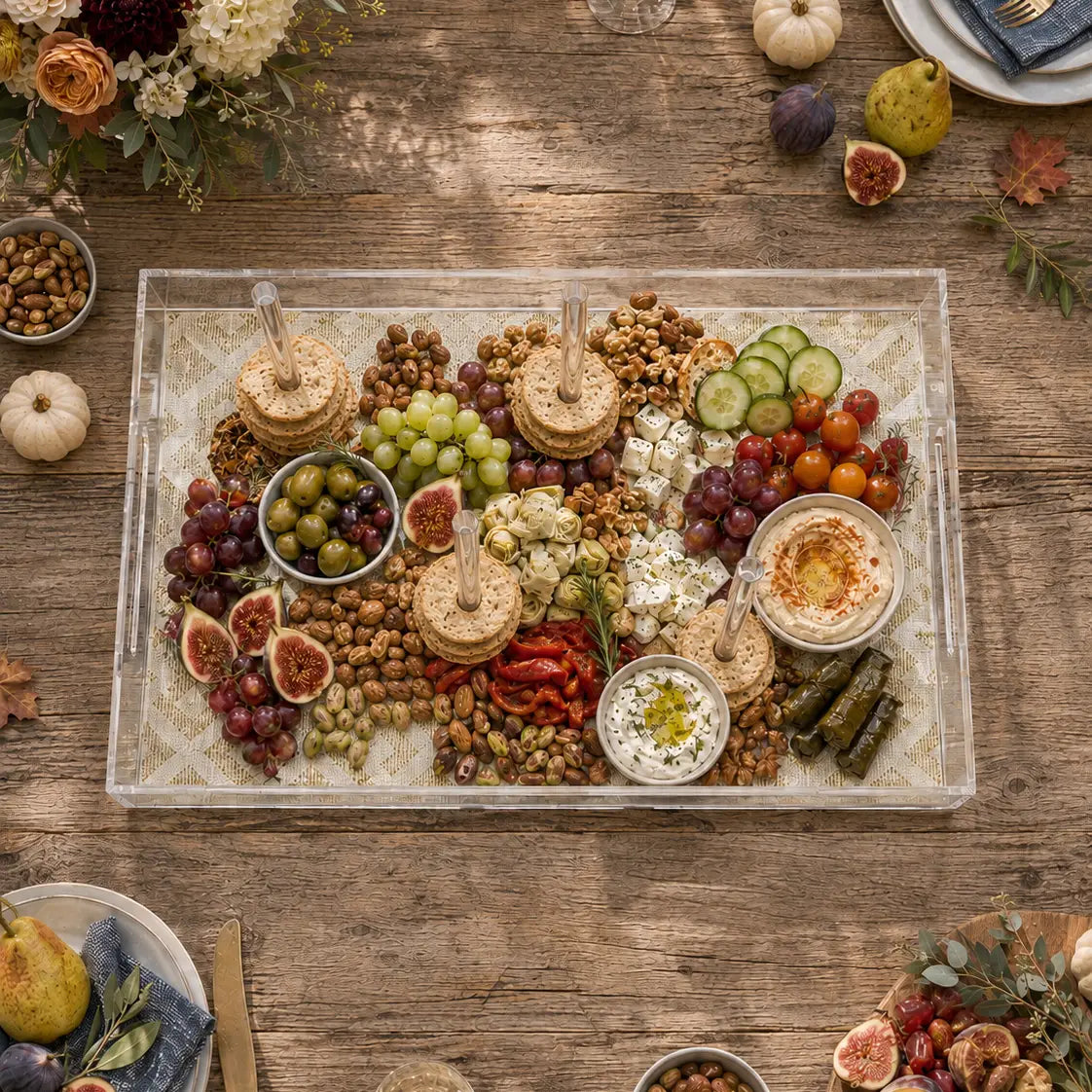 Brunch bagel board on a clear acrylic serving tray with fall decor