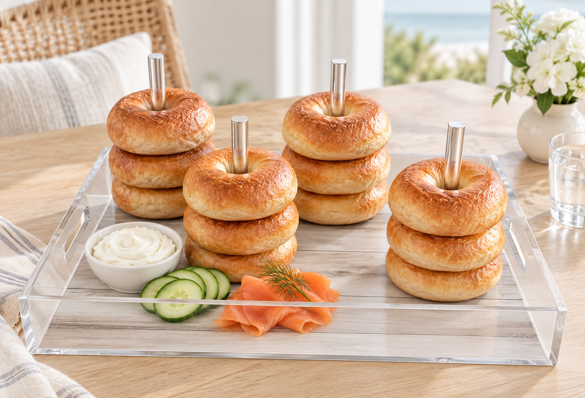 Bagels stacked on the dowels with smoked salmon, cucumber and cream cheese in a sunny dining room