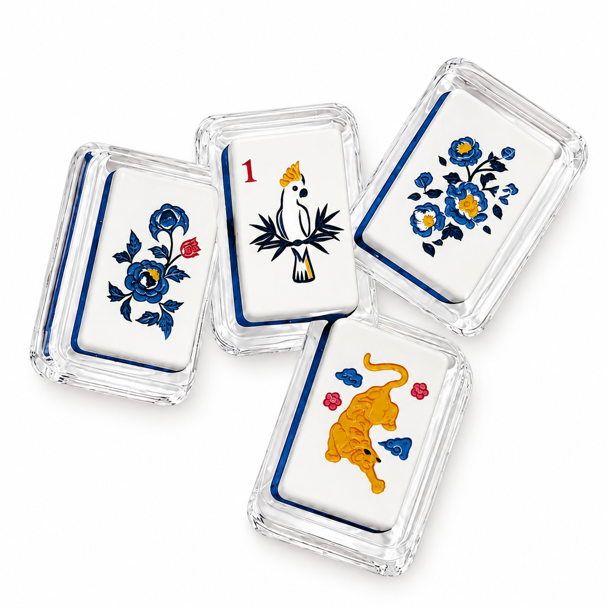 Mahjong 2 acrylic napkin weight on white, showing four tiles with blue flowers, a bird and a tiger