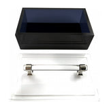 Black acrylic box base beside its clear lid with silver handle