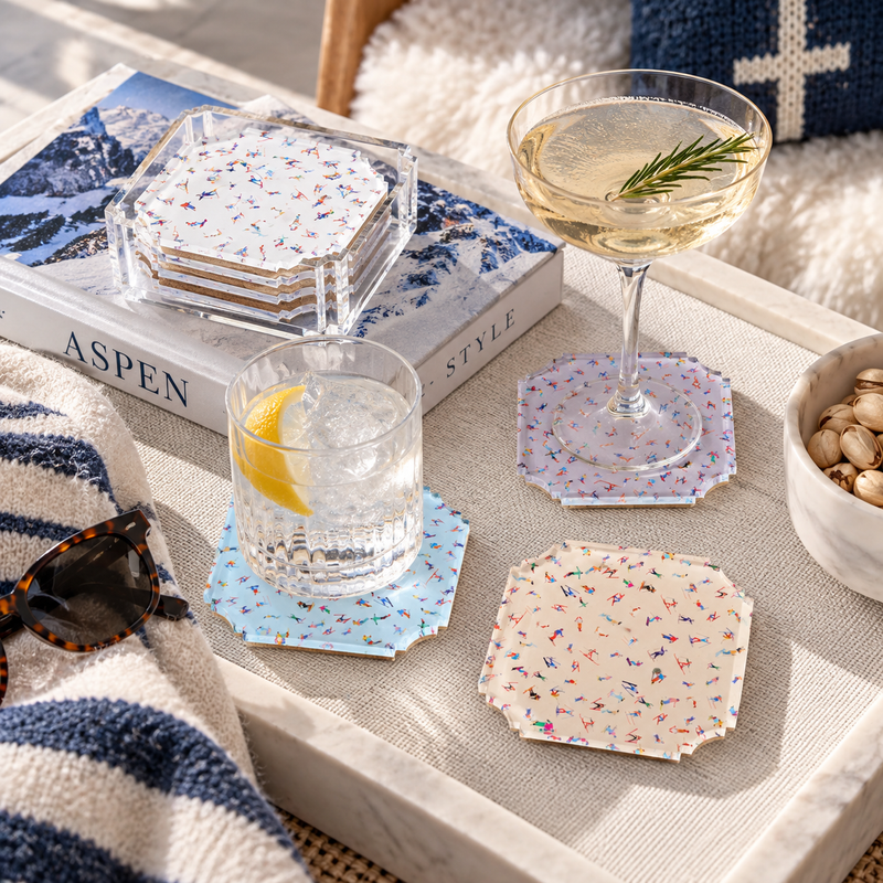 Maven Home Aspen acrylic coaster set with colorful ski artwork, styled for winter entertaining, gifting and mountain home decor