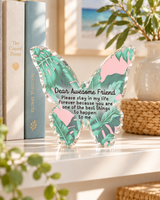 Butterfly-shaped acrylic desk weight reading Dear Awesome Friend, styled as home decor