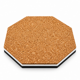 Cork back of an octagonal coaster with a white and black acrylic edge
