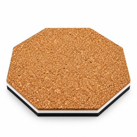 Cork back of an octagonal coaster with a white and black acrylic edge