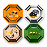 Four octagonal striped coasters laid flat: orange with a sardine tin, white with caviar, pink with oysters and green with skewered olives