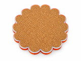 Cork back of a scalloped round coaster with an orange acrylic edge