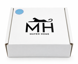 White gift box with a black panther logo and a blue cane coaster sticker