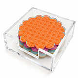 Cabana coaster set in a clear acrylic holder, angled view with the orange cane coaster on top