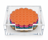 Cabana coasters stacked in a clear acrylic holder showing orange, pink, blue and sand layers with cork backs