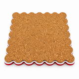 Cork back of a scalloped square coaster with red and white acrylic edges