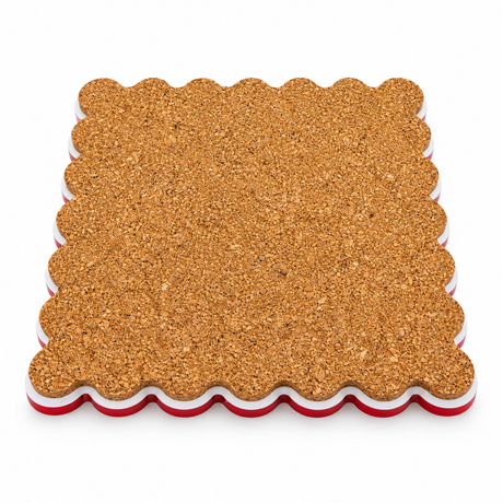 Cork back of a scalloped square coaster with red and white acrylic edges