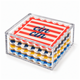 Dolce Vita coaster set stacked in its clear acrylic storage box on white