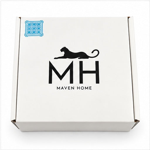 White gift box with a black panther logo and a trellis coaster sticker