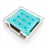 Heritage Trellis coaster set in a clear acrylic holder, angled view with the aqua coaster on top