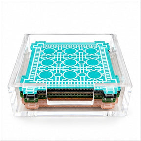 Aqua trellis coaster on top of a stack of four in a clear acrylic holder, front view