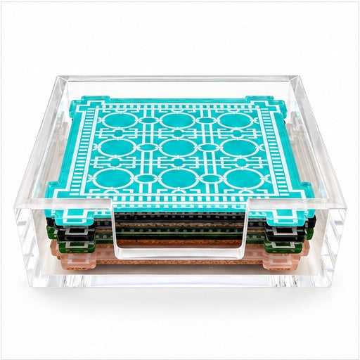 Low view of the coaster stack in its acrylic holder showing aqua, green, black and peach edges with cork backs