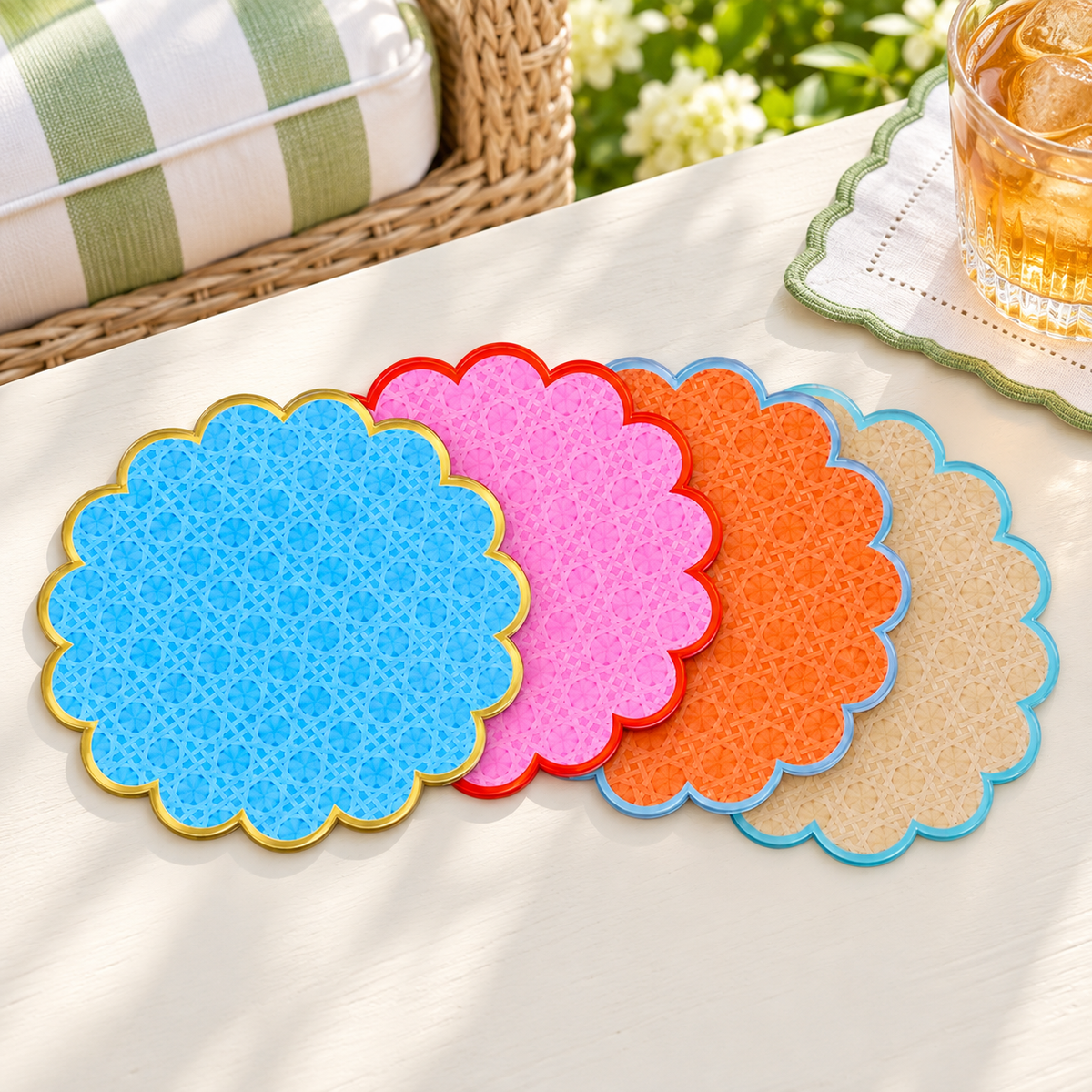 Cabana coasters on a garden room table with green striped cushions