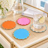Cabana coasters on a gold tray beside a glass of water with lemon