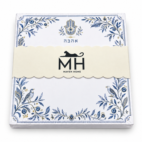 Angled view of the wrapped Hamsa and Ahava notepad with Hebrew Ahava and a gold hamsa