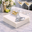 Martini acrylic napkin weight: a classic martini glass with three skewered olives, drawn in fine black lines