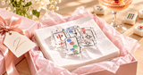 Mahjong acrylic napkin weight on white cocktail napkins in a pink gift box with tissue paper and ribbon