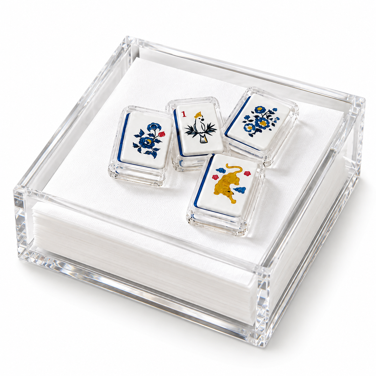 Mahjong 2 acrylic napkin weight on white napkins in a clear acrylic napkin holder, on a white background