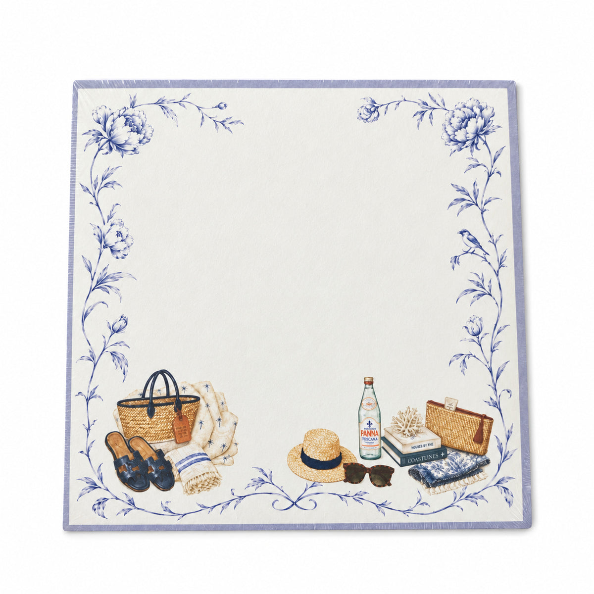 Front view of the Proper Beach Club 5x5 notepad with a lavender border, blue florals, a straw tote and sun hat
