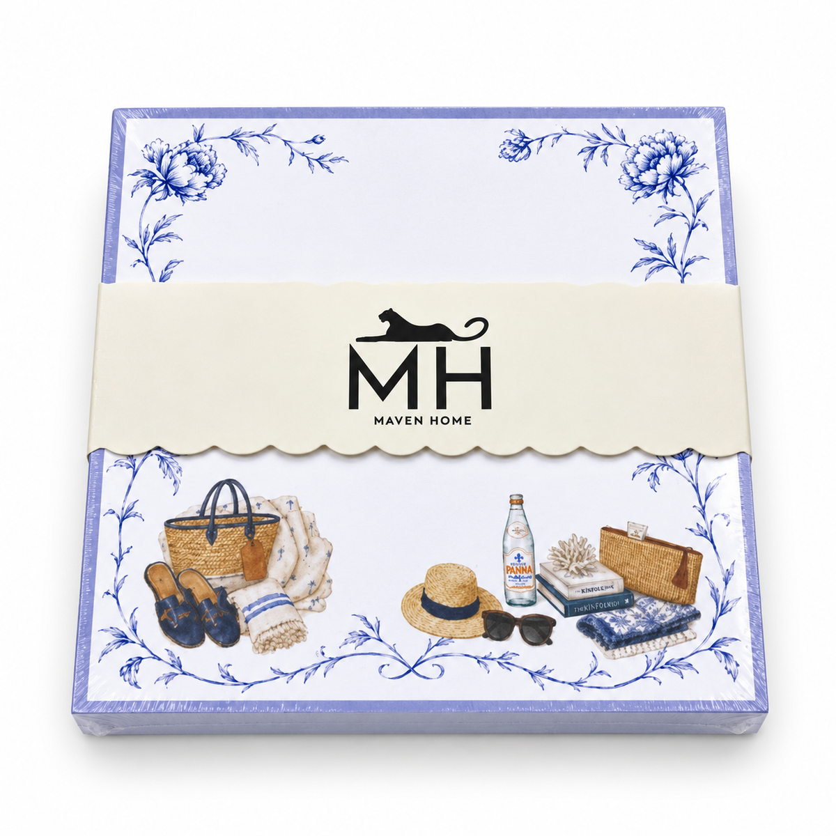Beach notepad in its MH band with a lavender border, blue florals, a straw tote, sun hat and sandals