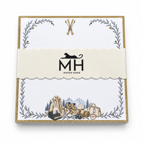 Proper Ski notepad in its MH band with crossed skis, a gold border, pine branches and ski gear