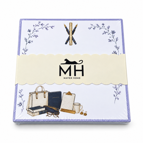 Proper Teacher notepad in its MH band with crossed pens and a ruler, books, a clipboard and a tote