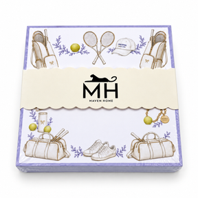 Proper Tennis notepad in its MH band with a lavender border, crossed rackets, tennis bags and balls