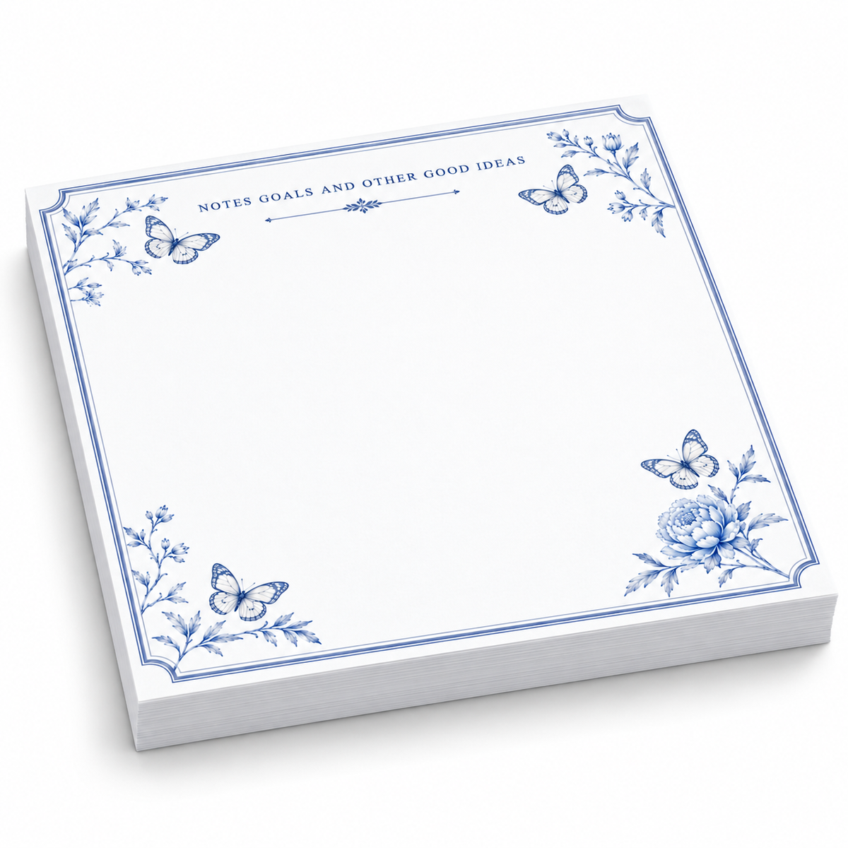 Notes, Goals and Other Good Ideas 5x5 notepad with blue butterflies and a peony, angled view on white