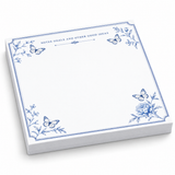 Notes, Goals and Other Good Ideas 5x5 notepad with blue butterflies and a peony, angled view on white
