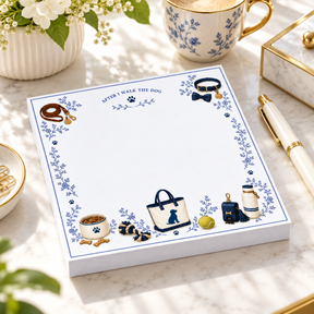 Proper Dogs After I Walk the Dog 5x5 notepad on a marble desk with a gold pen, blue-and-white teacup and white flowers