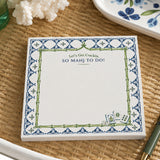 So Mahj to Do! notepad with blue tile border on a rattan tray with coral