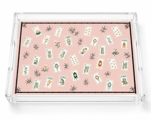 Empty pink mahjong tile acrylic tray on white showing its clear side handles