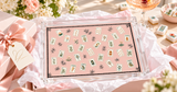 Mahjong Pink Lotus acrylic vanity tray in a pink gift box with tissue paper and ribbon